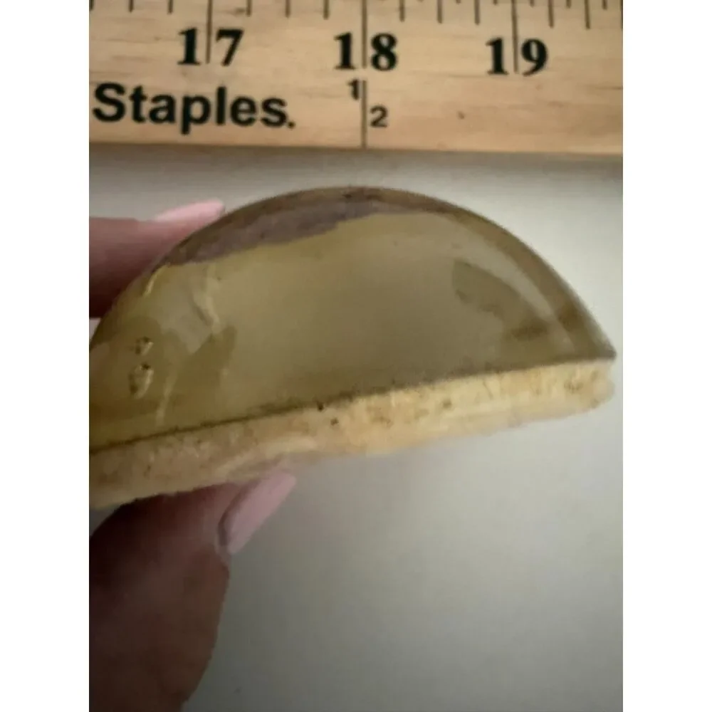 Vintage homemade paperweight with cloth or wood object